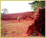 The crumbling mud-built outer enclosure walls of the Royal Palaces of Abomey UNESCO world heritage site (Benin, West Africa)