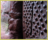 A heavy studded wooden door to one of the rock-hewn churches of Lalibela (a UNESCO world heritage site, Ethiopia)