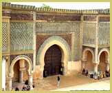 The magnificent gate, Bab Mansour flanks the Place El Hedim at the Historic City of Meknes UNESCO world heritage site, Morocco