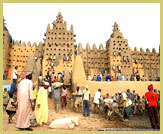 Replastering the world's largest mud-built building, the Grand Mosque at Djenne (part of the UNESCO world heritage site, Mali)