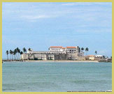 View across the bay to Elmina Castle, one of the prominent European-built Forts and Castles on the West coast of Africa, part of the UNESCO world heritage site (Central Region, Ghana)