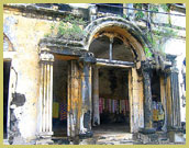 Elaborate colonnaded portico of one of the prominent French colonial buildings in the historic town of Grand-Bassam UNESCO world heritage site (Cote d'Ivoire)