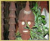 Wooden totems ('waga' statues) in the forest surrounding Chief Gezahegne Woldu's compound in the Konso Cultural Landscape UNESCO world heritage site, Ethiopia 