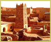 Typical square minaret of the mosque in the old town of Chinguetti, one of the Ancient Ksour designated as UNESCO world heritage sites on the edge of the Sahara Desert in Mauritania