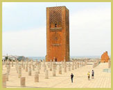 The imposing minaret and bases of the prayer hall columns in the unfinished Almohad-era Hassan Mosque, one of the prominent monuments in the Rabat UNESCO world heritage site (Morocco)