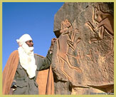 The famous 'fighting cats' engaving is found in the Sahara desert just outside the Tadrart Acacus UNESCO world heritage site (Libya), one of nine places featured in the rock-art and prehistory category