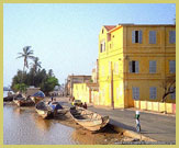 Typical French colonial architecture along one of the quaysides on the Island of Saint-Louis UNESCO world heritage site, Senegal