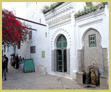 Public fountain and entrance to one of the many historic mosques in the Medina of Tetouan UNESCO world heritage site, Morocco